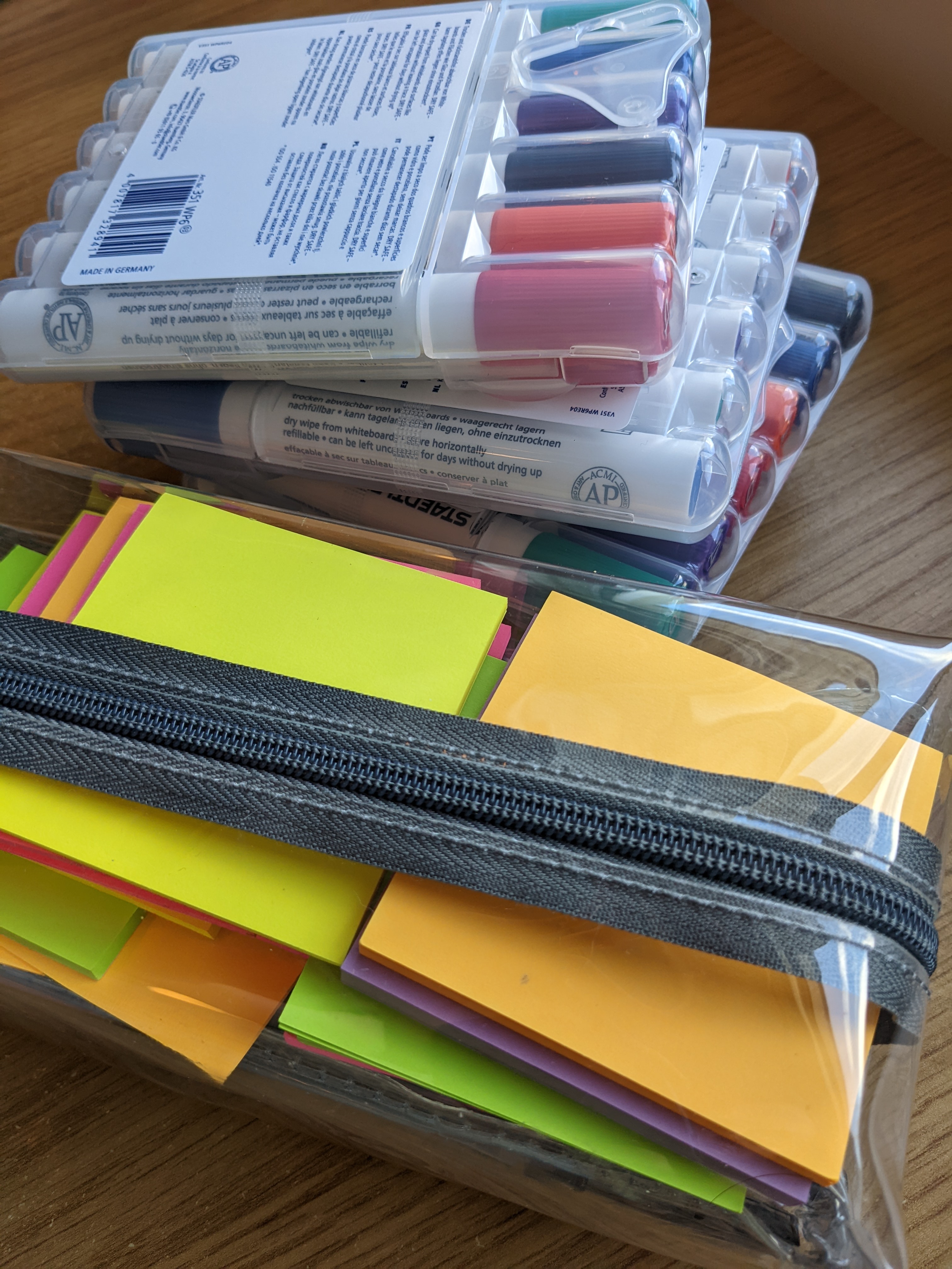 Post its and marker pens in a pile