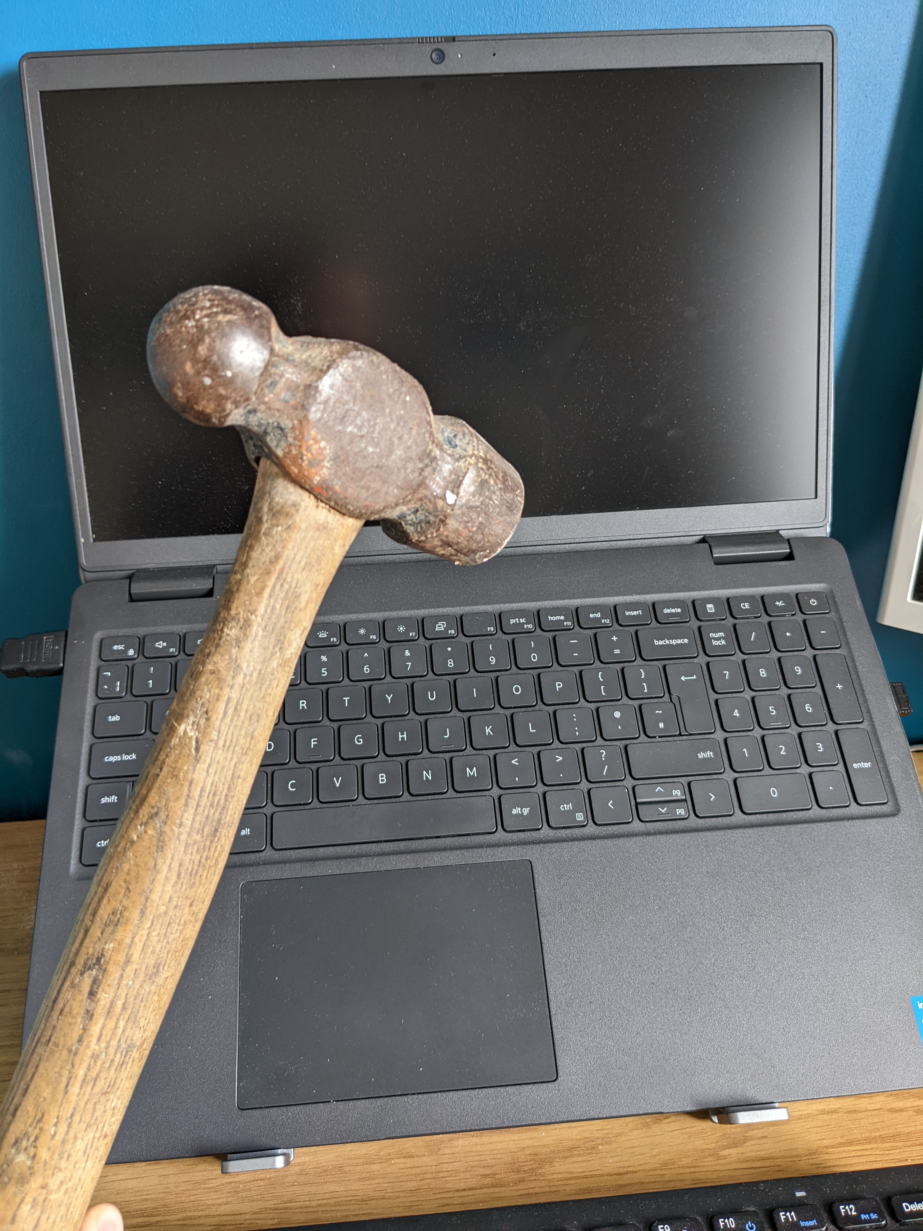 Hammer over laptop