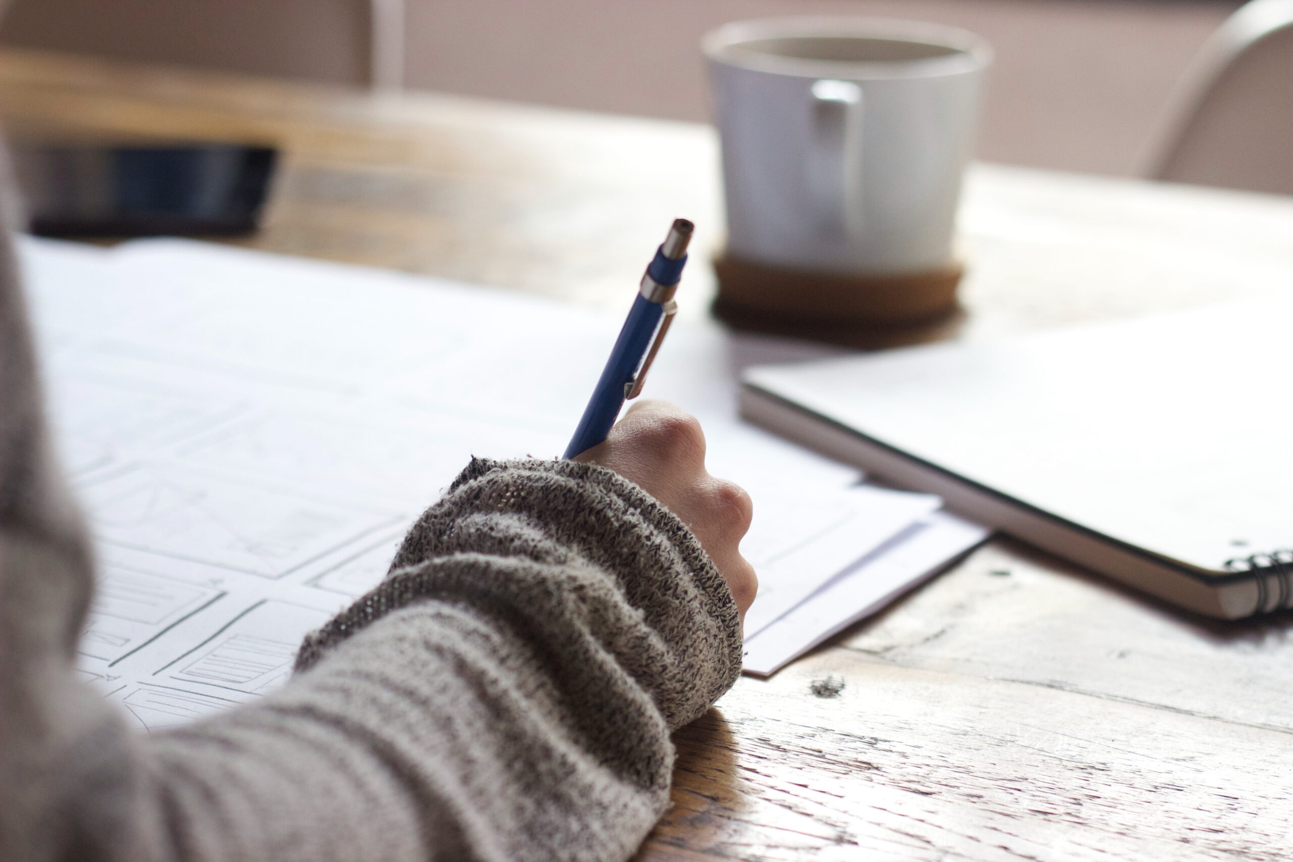 Writing with a mug coffee