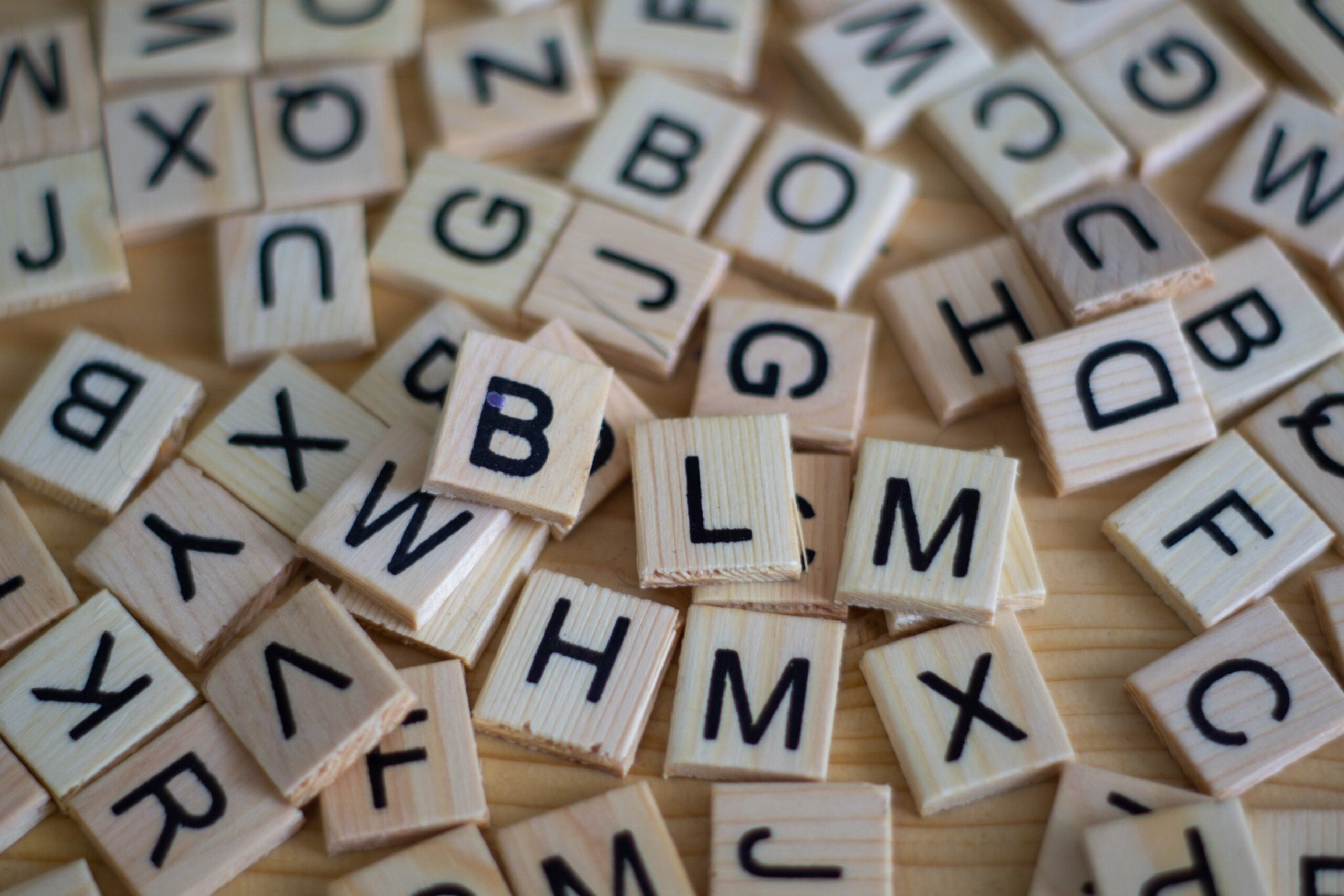 A pile of wooden letter tiles